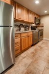 Fully remodeled and equipped kitchen with stainless steel appliances, dishwasher, oven, electric stove, microwave